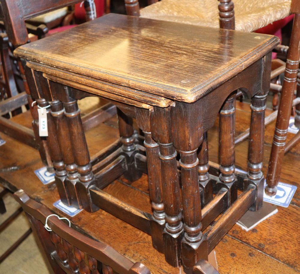 A nest of three rectangular oak tables, W.53cm, D.33cm, H.47cm